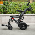 Super Lightweight Portable Transit Travel Wheelchair, Upgraded Folding Transport Wheelchairs (Weight 26.7lbs) for Adults and Seniors, Come with Telescopic Handle and Travel Bag